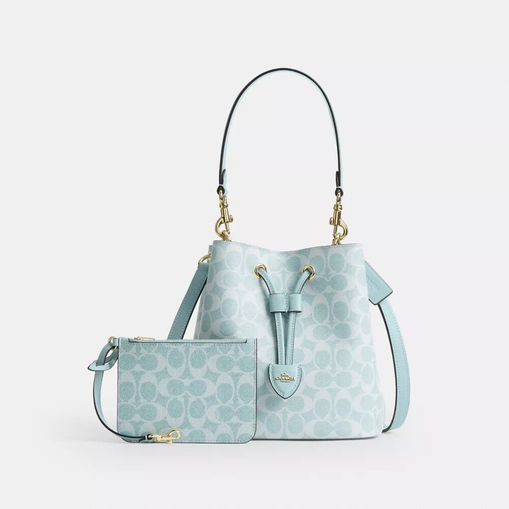 Bolso tipo cubeta Rowan en Signature Canvas