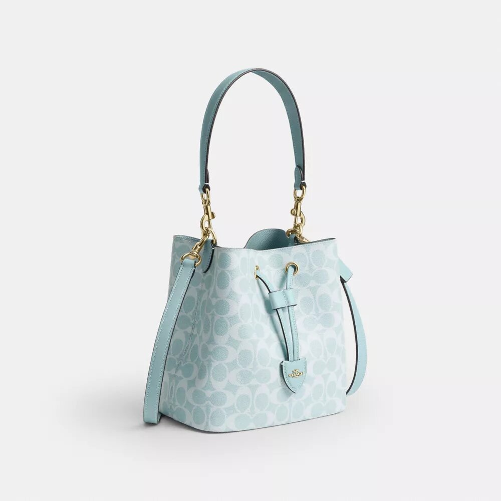 Bolso tipo cubeta Rowan en Signature Canvas