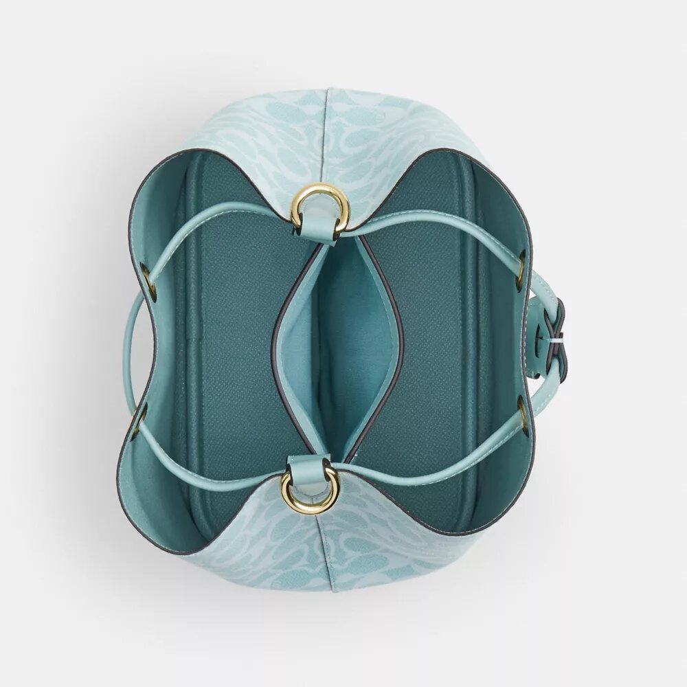 Bolso tipo cubeta Rowan en Signature Canvas