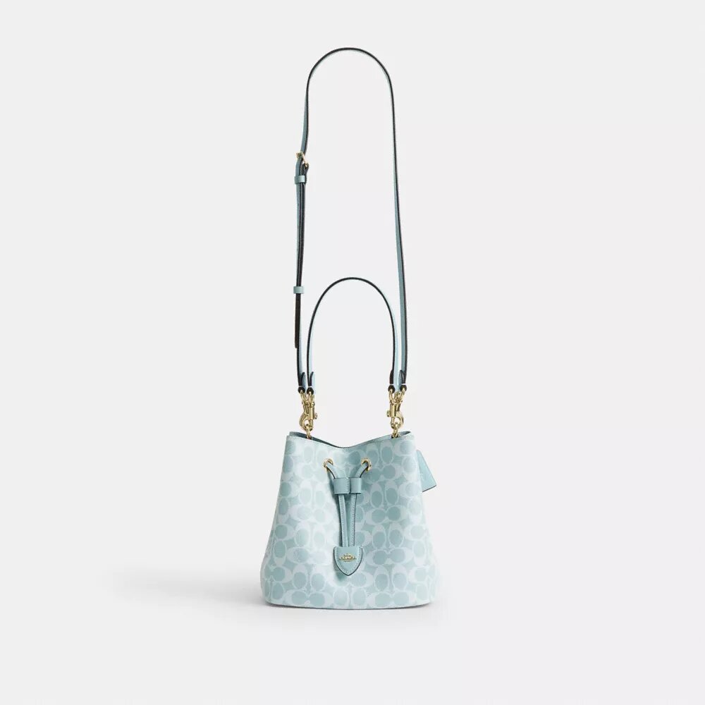 Bolso tipo cubeta Rowan en Signature Canvas