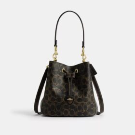 Bolso tipo cubeta Rowan en Signature Canvas con Charms