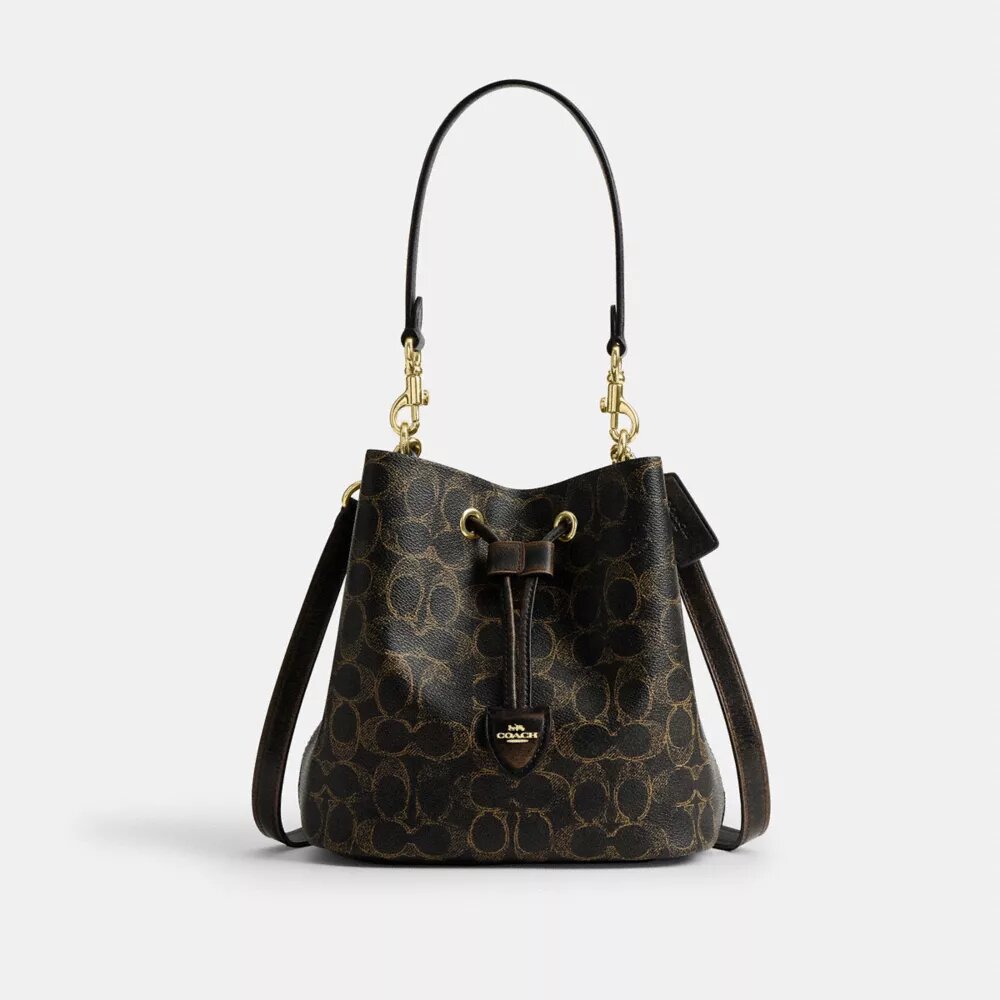 Bolso tipo cubeta Rowan en Signature Canvas con Charms