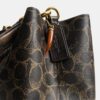 Bolso tipo cubeta Rowan en Signature Canvas con Charms