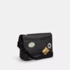 Bolso tipo mensajero Hitch en Signature Canvas con parches