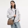 Bolso tipo mensajero Jack en Signature Canvas