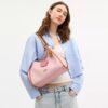 Bolsos de hombro Erin en Signature Canvas con Charms