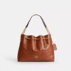 Bolsos de hombro Evelyn con acolchado y Charms