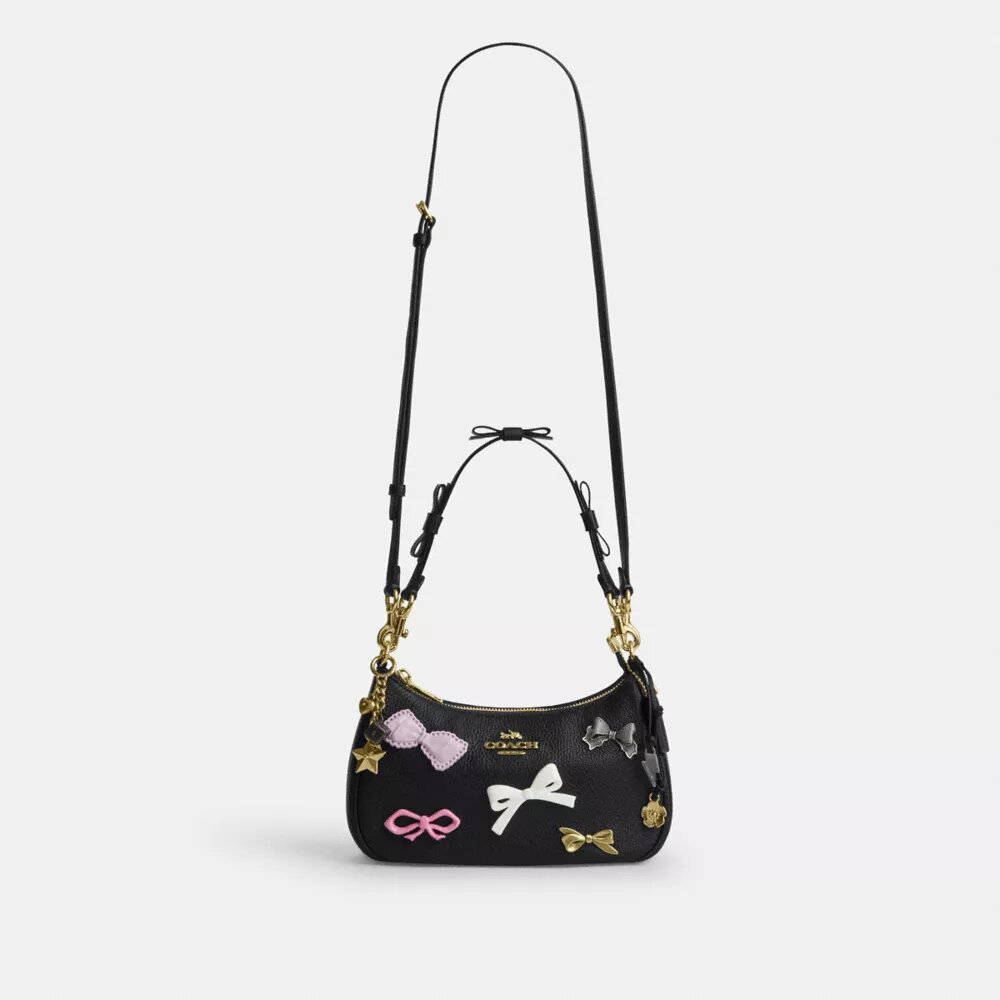 Bolsos de hombro Teri con moños y Charms