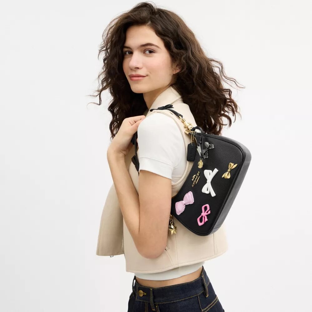 Bolsos de hombro Teri con moños y Charms