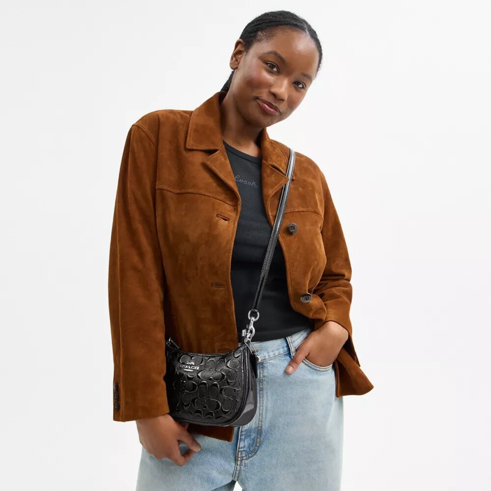 Bolsos de hombro Teri en cuero exclusivo con dije de corazón