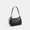 Bolsos de hombro Teri en cuero exclusivo con dije de corazón