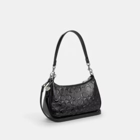 Bolsos de hombro Teri en cuero exclusivo con dije de corazón