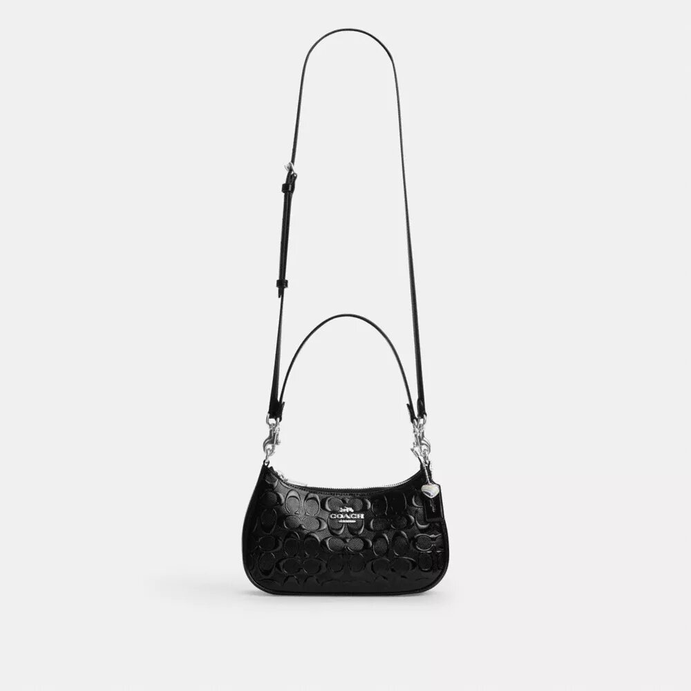 Bolsos de hombro Teri en cuero exclusivo con dije de corazón