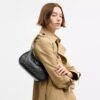 Bolsos de hombro Teri en cuero exclusivo con dije de corazón