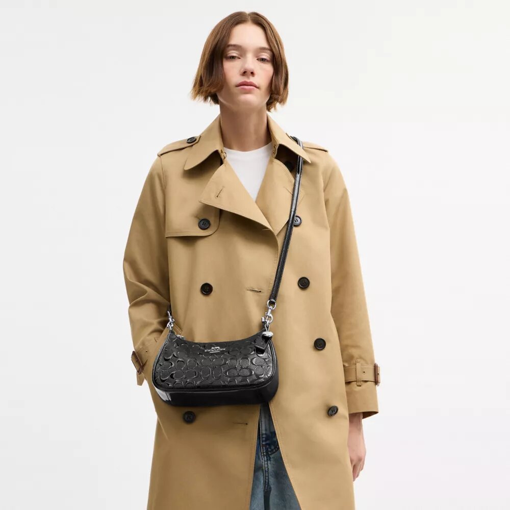 Bolsos de hombro Teri en cuero exclusivo con dije de corazón