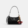 Bolsos de hombro Teri en cuero exclusivo con dije de corazón