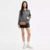 Bolsos de hombro Teri en Signature Canvas