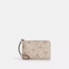 Bolsos de pulsera con cremallera en la esquina, en Signature Canvas con estampado floral