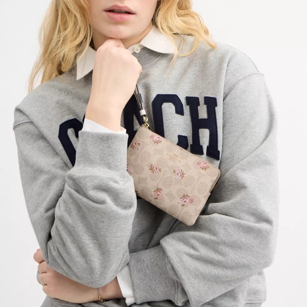 Bolsos de pulsera con cremallera en la esquina, en Signature Canvas con estampado floral