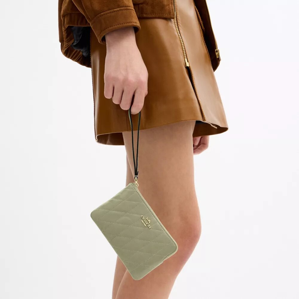 Bolsos de pulsera con cremallera en la esquina y acolchado