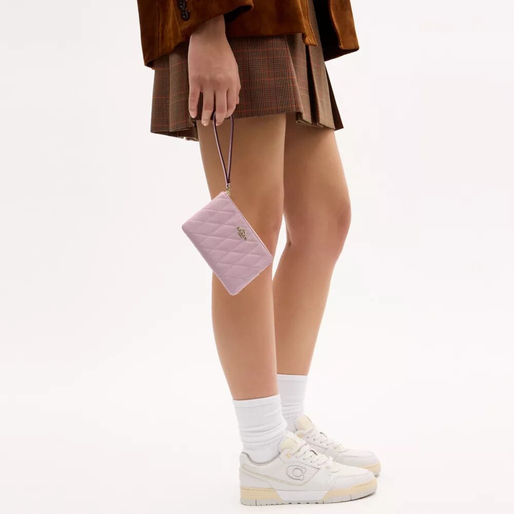 Bolsos de pulsera con cremallera en la esquina y acolchado