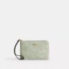 Bolsos de pulsera con cremallera en la esquina y estampado floral