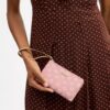 Bolsos de pulsera con cremallera en la esquina y estampado floral