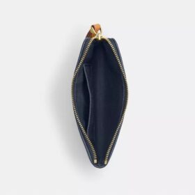 Bolsos de pulsera con cremallera en las esquinas en denim característico