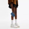 Bolsos de pulsera con cremallera en las esquinas en denim característico