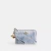 Bolsos de pulsera con cremallera en las esquinas en denim desgastado con Charms