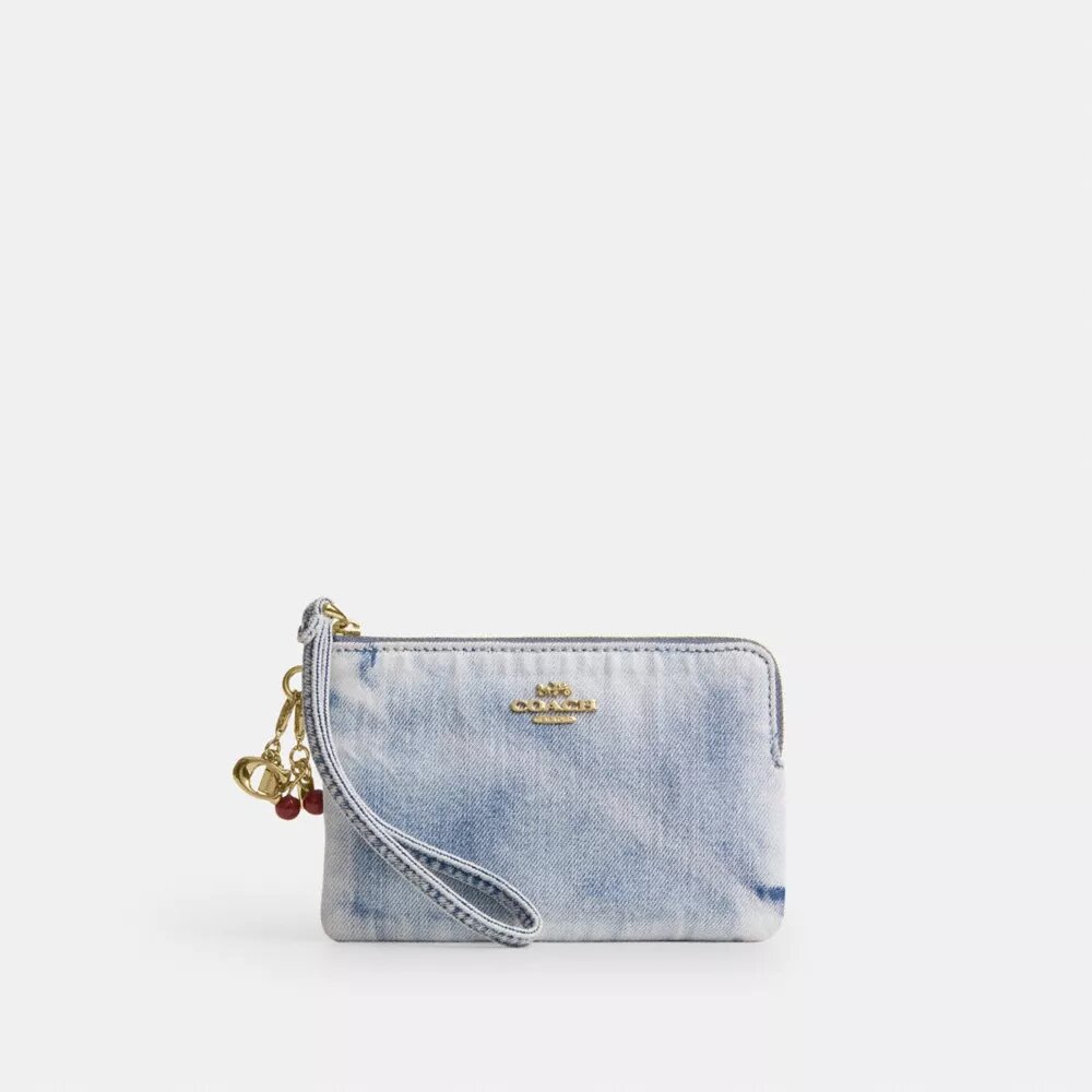 Bolsos de pulsera con cremallera en las esquinas en denim desgastado con Charms