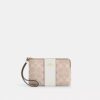Bolsos de pulsera con cremallera en las esquinas en Signature Canvas con rayas