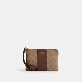 Bolsos de pulsera con cremallera en las esquinas en Signature Canvas con rayas