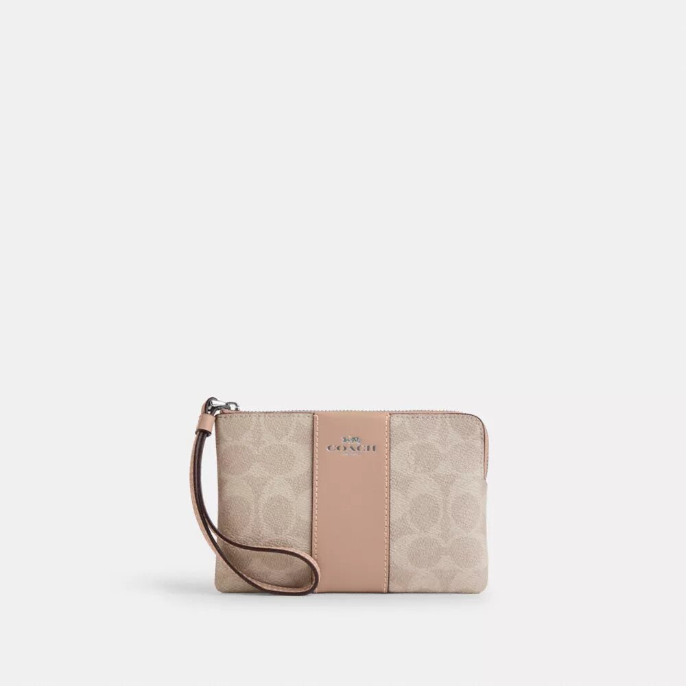 Bolsos de pulsera con cremallera en las esquinas en Signature Canvas con rayas