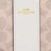 Bolsos de pulsera con cremallera en las esquinas en Signature Canvas con rayas
