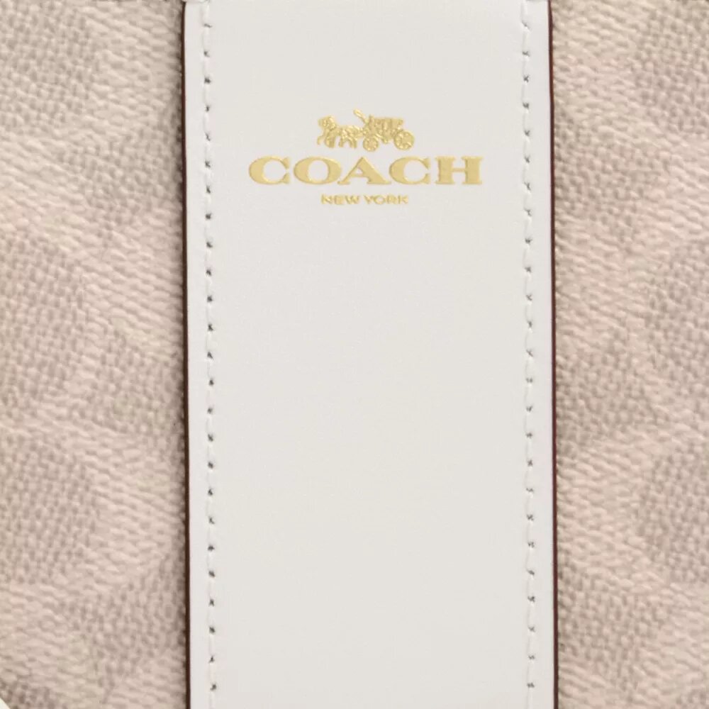 Bolsos de pulsera con cremallera en las esquinas en Signature Canvas con rayas