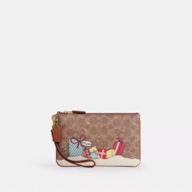 Bolsos de pulsera Essential en Signature Canvas con regalos navideños