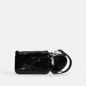 Bolsos de pulsera y neceser en forma de corazón con dije