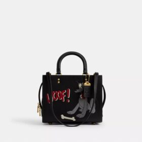 Bolsos Rogue 25 de Disney x Coach con Pluto