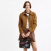 Bolsos Rogue 25 de Disney x Coach con Pluto