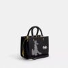 Bolsos Rogue 25 de Disney x Coach con Pluto