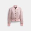 Cardigan con corazones en miniatura