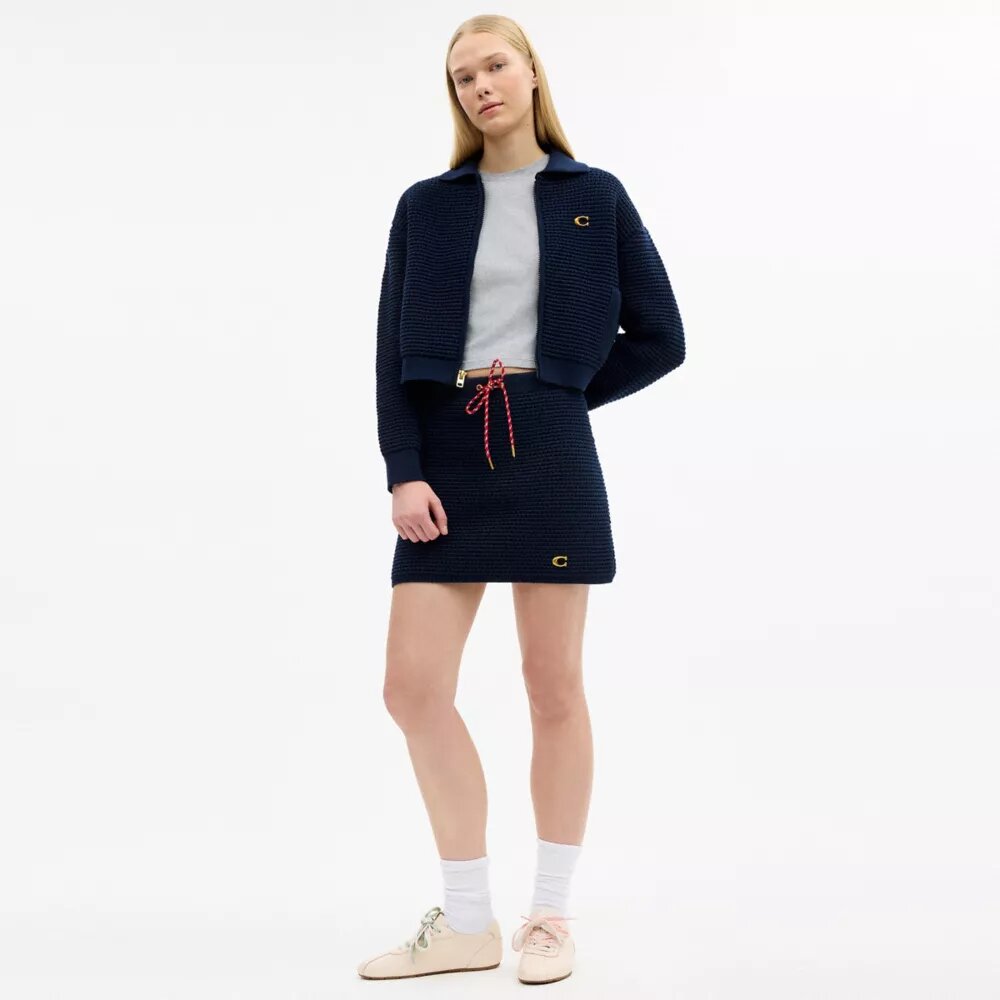 Cardigan con cremallera frontal
