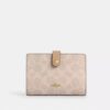 Cartera 2 en 1 en Signature Canvas con diseño a bloques
