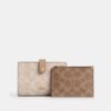 Cartera 2 en 1 en Signature Canvas con diseño a bloques