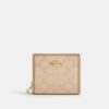 Cartera con broche y Signature Canvas
