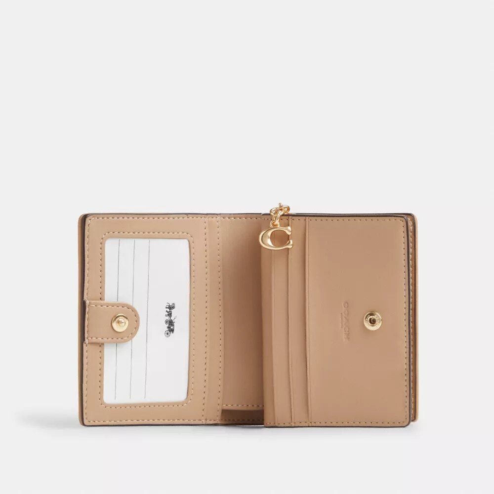 Cartera con broche y Signature Canvas