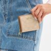 Cartera con broche y Signature Canvas
