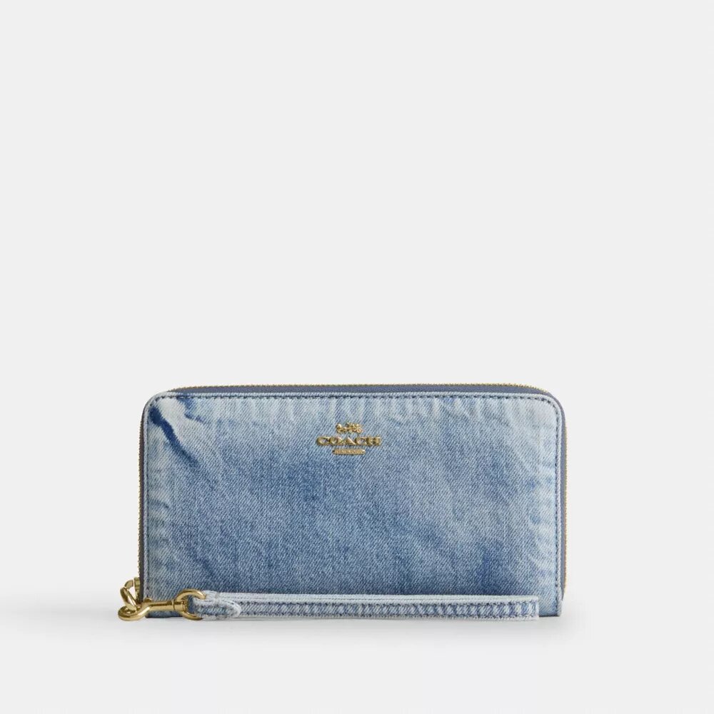 Cartera larga con cierre de cremallera alrededor en denim desgastado