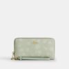 Cartera larga con cierre de cremallera alrededor y estampado floral